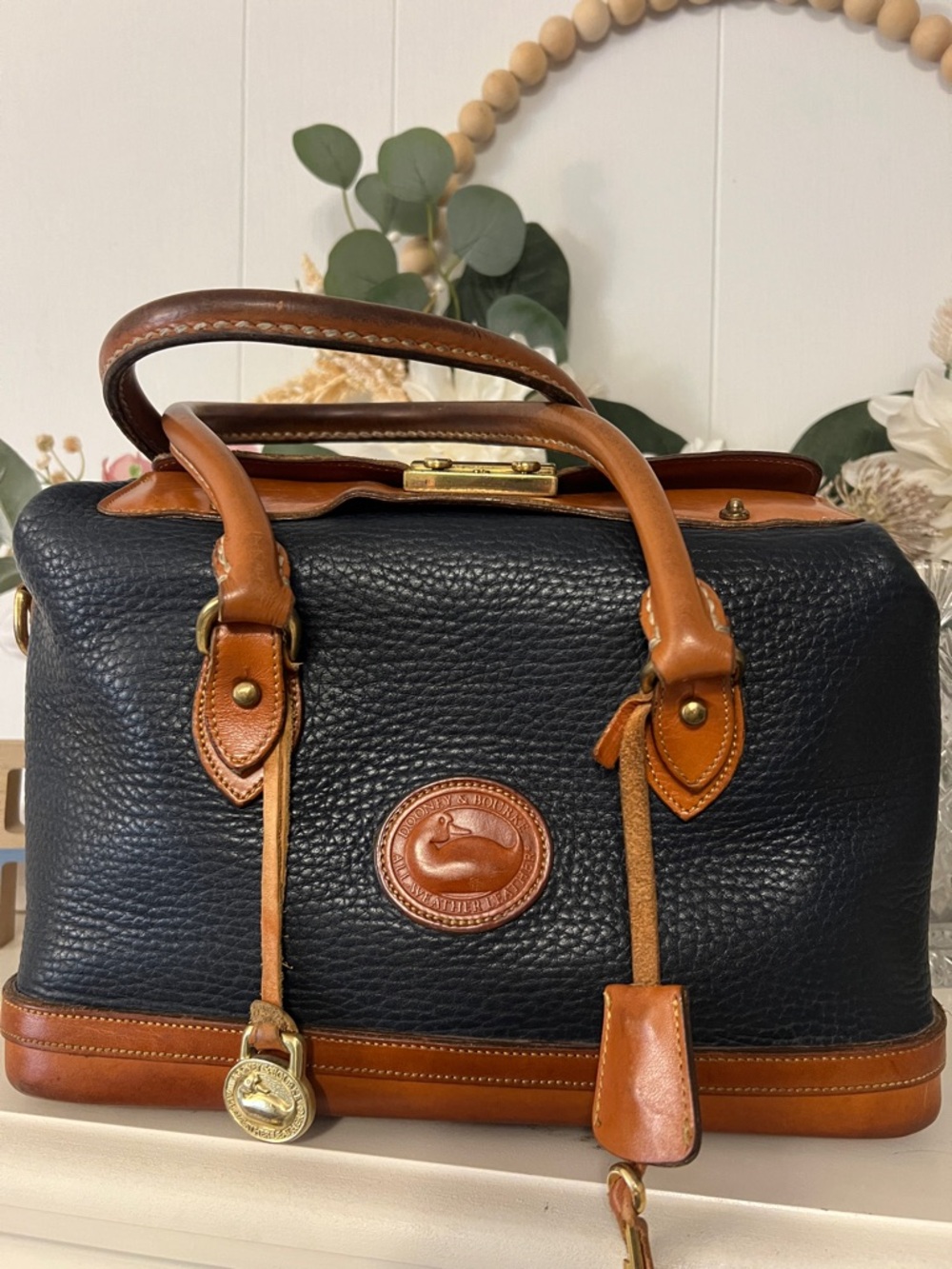 Dooney & Bourke Vintage All-Weather Leather Lock Satchel Navy and Brown